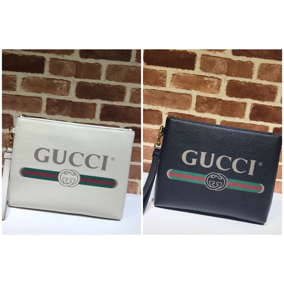 Gucci Print leather clutch